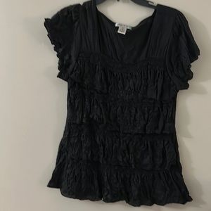 Vintage Suzie black top with short sleeves and ruffle torse.